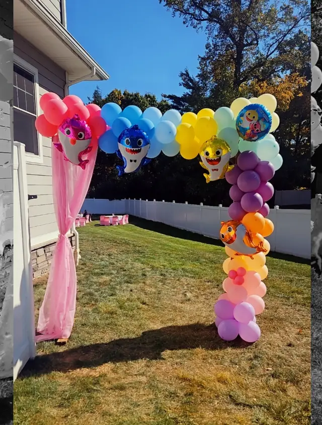 Baby Shark themed balloon arch and column on a lawn